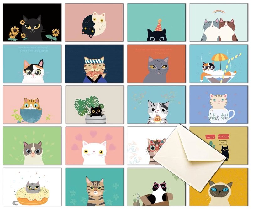 Assorted cat-themed thank you cards in colorful designs with a cream envelope on a white background.